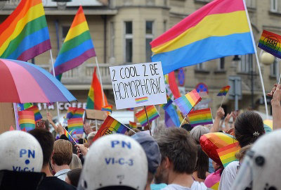 A Pansexual Pride flag (right) flies at the Katowice Pride Parade in Katowice, Poland