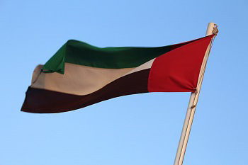 The flag of the United Arab Emirates flies