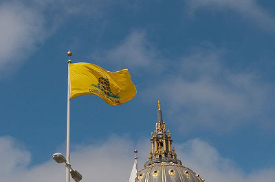 The Gadsden flag flying over the Civic Center Plaza in San Francisco, United States of America