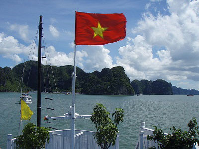 The flag of Vietnam flies in Halong Bay, Vietnam