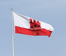 The flag of Gibraltar flies