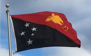 The flag of Papua New Guinea flies