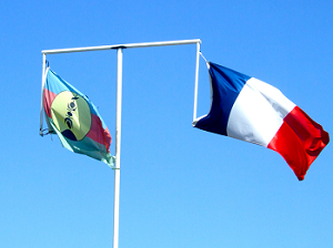 The flag of New Caledonia (right) flying alongside the French flag